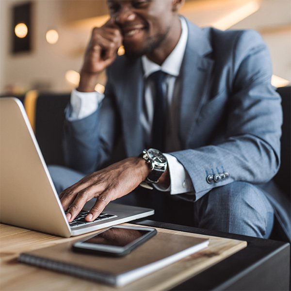 Insurance agent on a phone call while working on a laptop